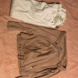 White pair of jeans and a off the shoulder jacket